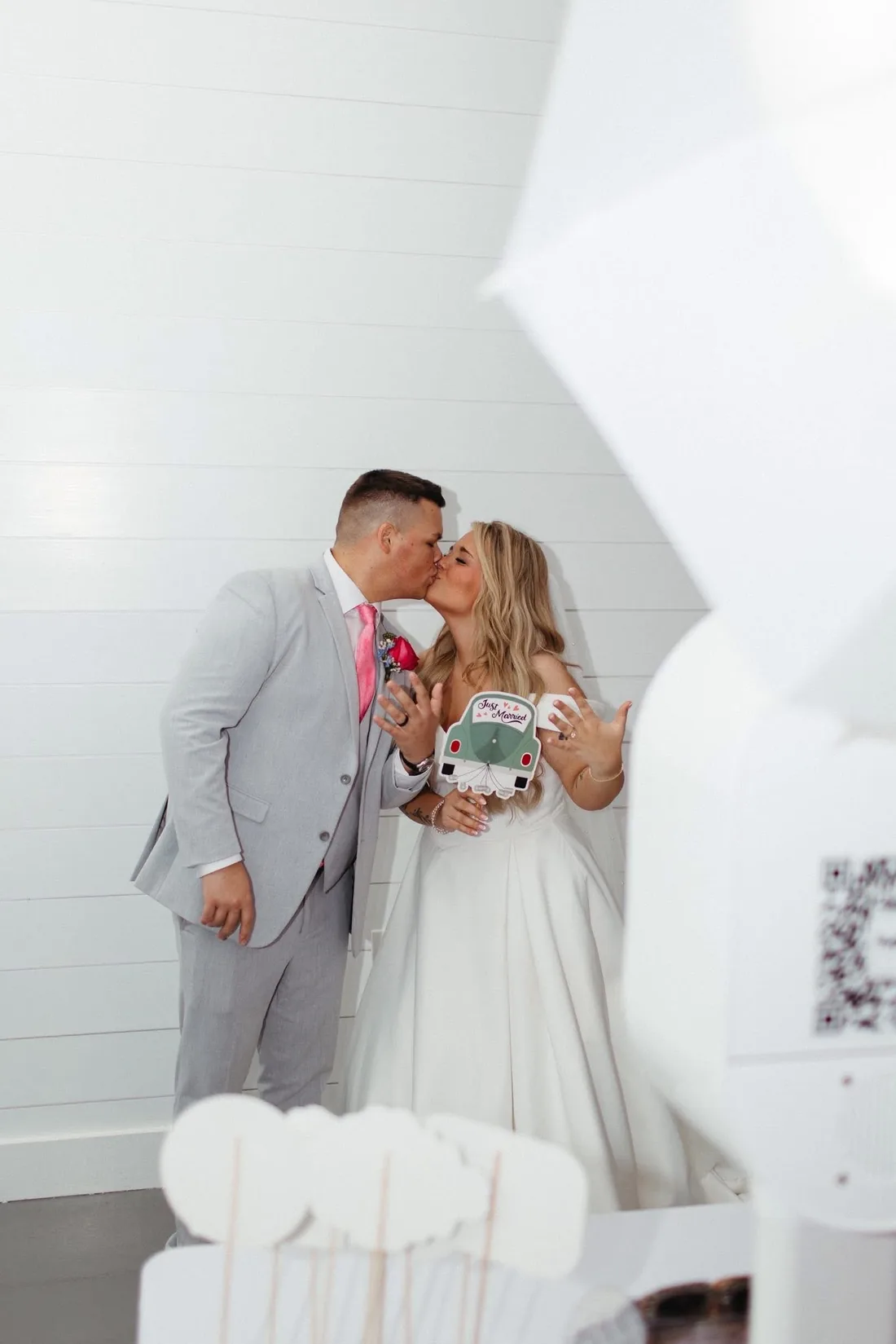 Couple beside the open air photo booth.